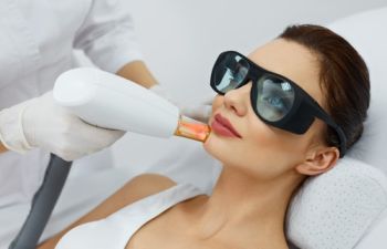 woman undergoing laser facial hair removal